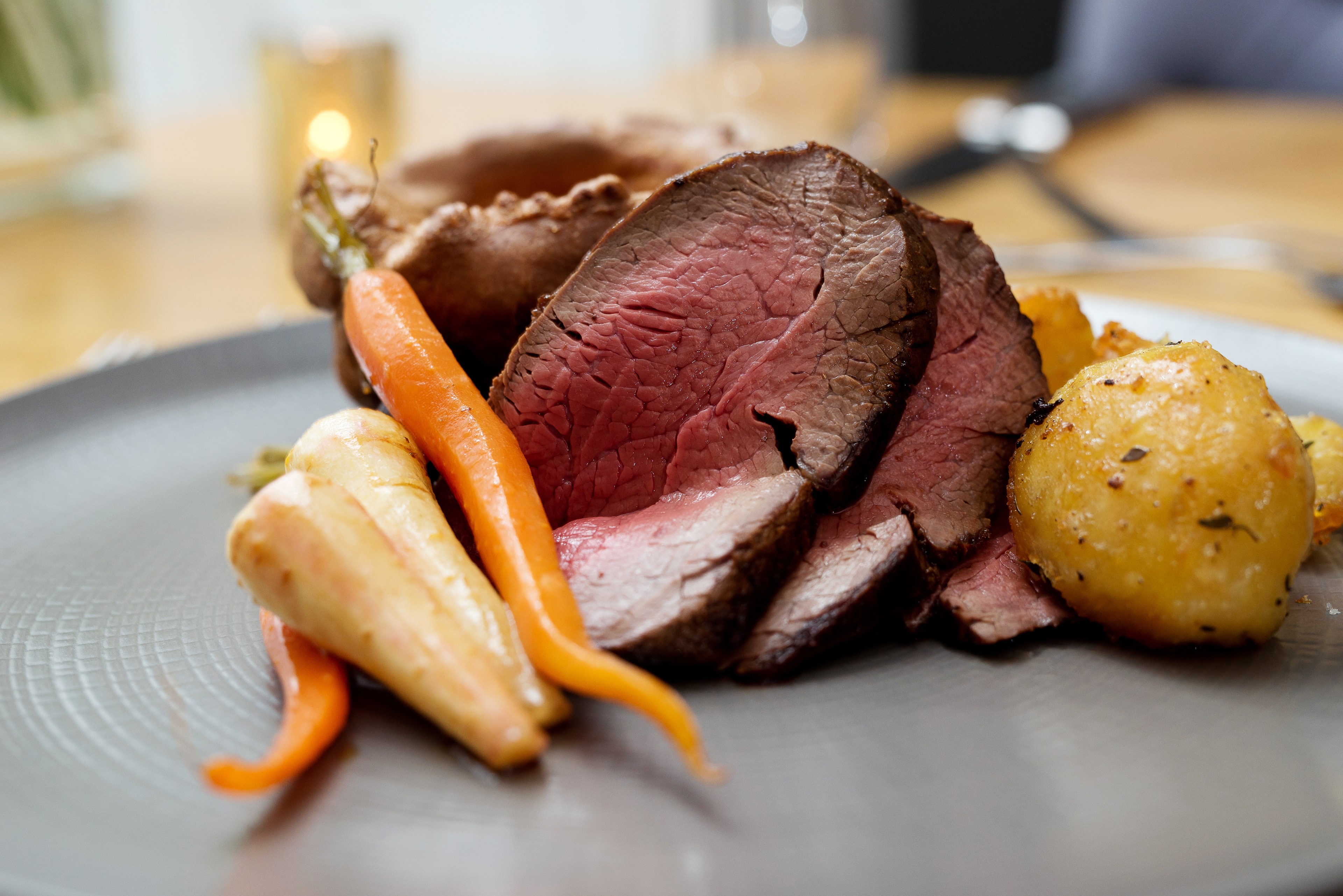 Plated beef with roasted vegetables and heritage carrots at Glewstone Court