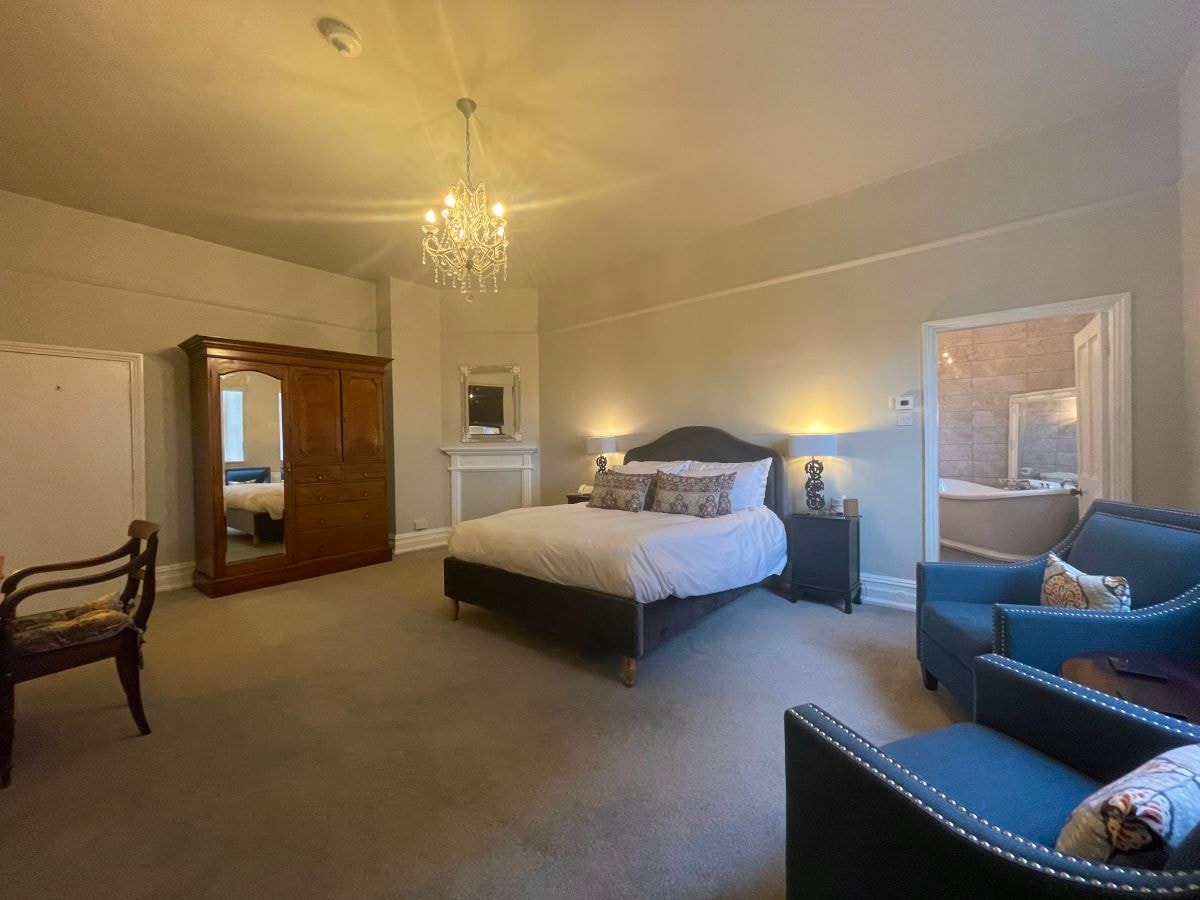 Wordsworth Room bedroom with chandelier